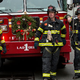 Three FDNY firefighters responding to a fire on Dec. 26, 2012 (Andrew Burton/Getty Images)